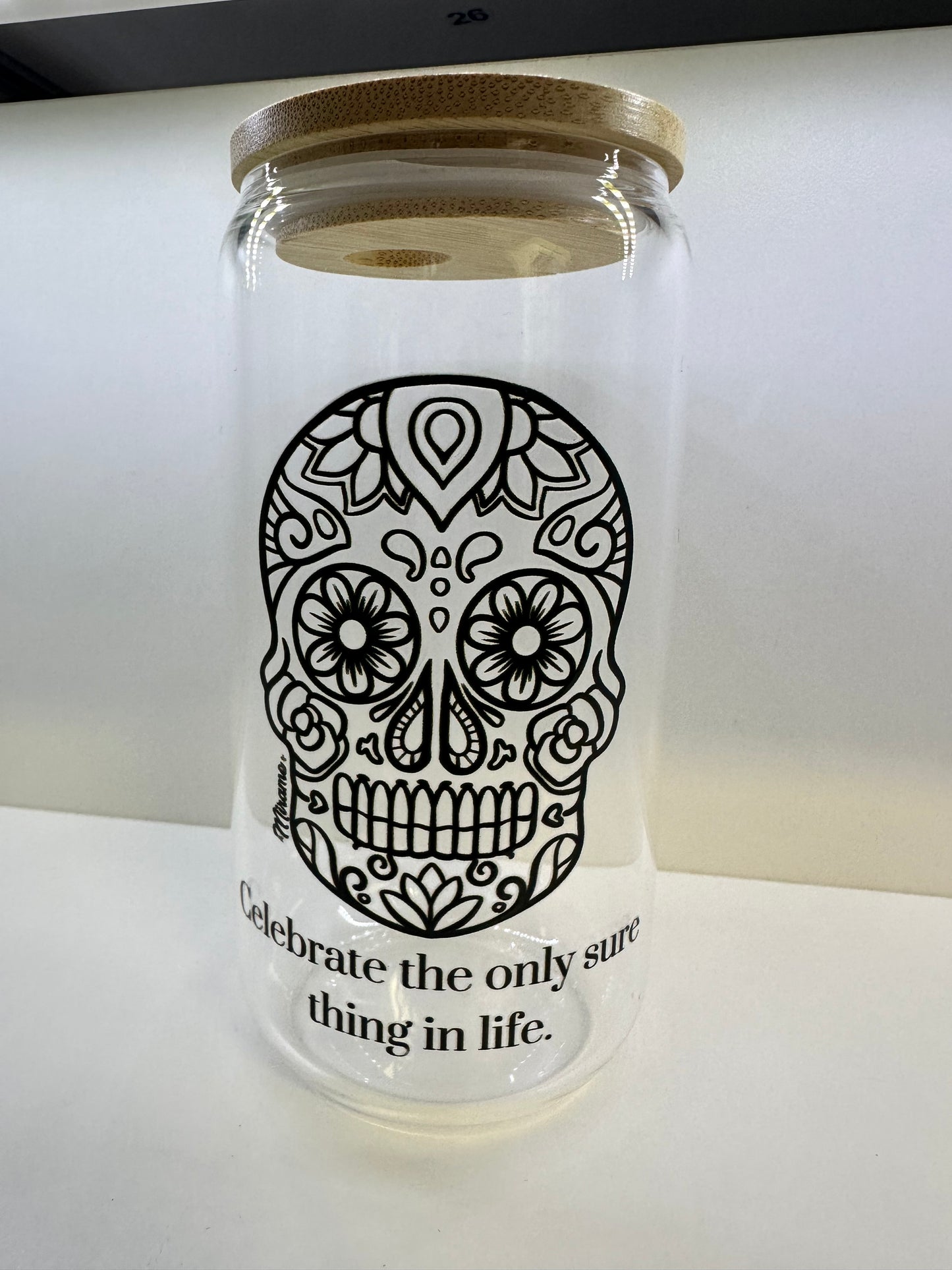 Glass cup with lid and "sugar skull design, Celebrate the only sure thing in life"
