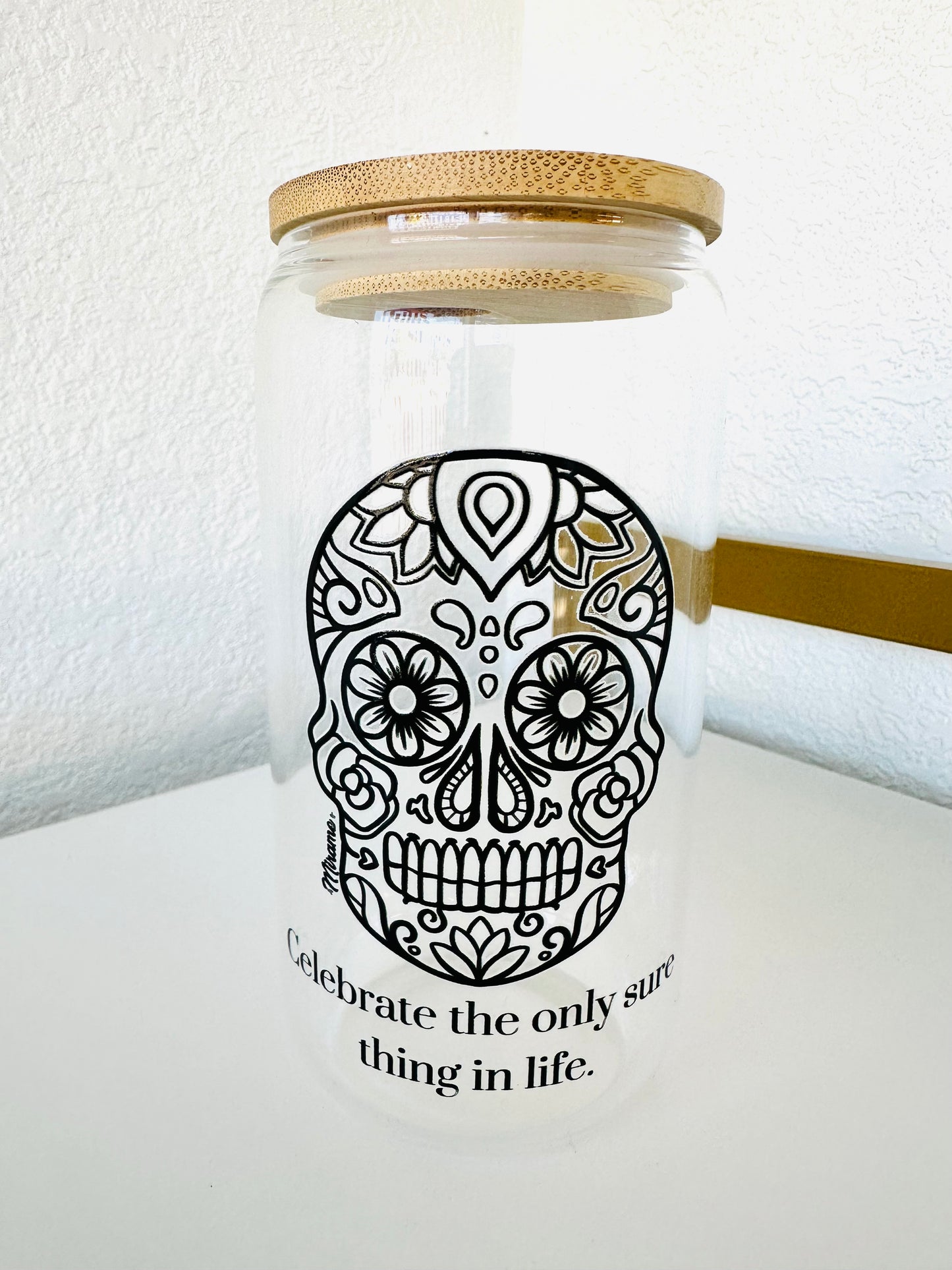 Glass cup with lid and "sugar skull design, Celebrate the only sure thing in life"