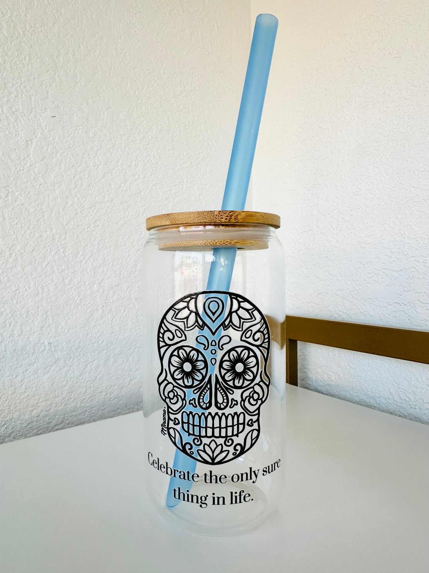 Glass cup with lid and "sugar skull design, Celebrate the only sure thing in life"