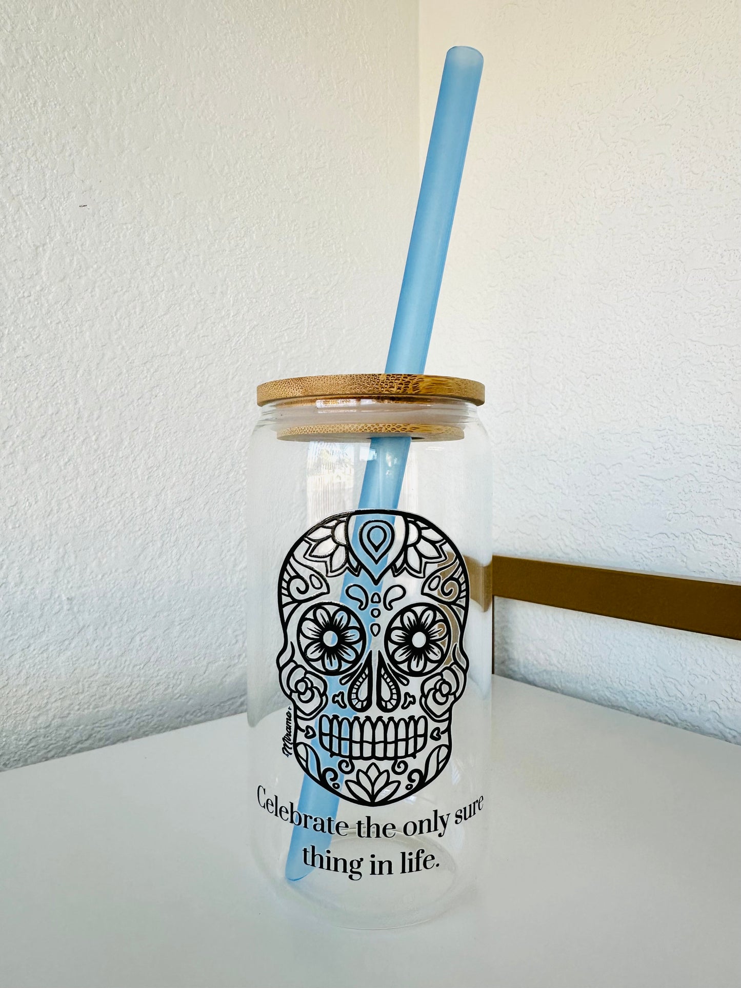 Glass cup with lid and "sugar skull design, Celebrate the only sure thing in life"